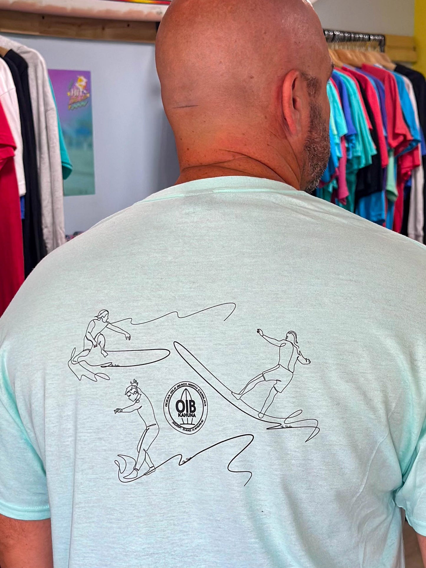 Trio surfers the "West End We Go's" T-shirt